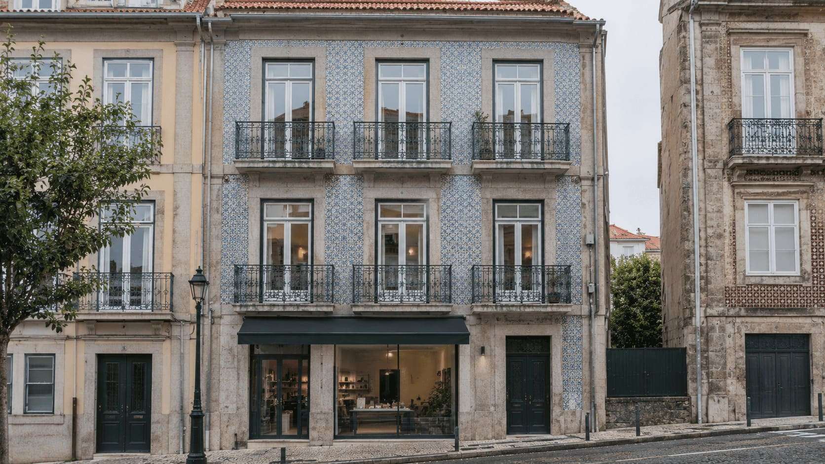 Renovated mixed-use building with shop and apartments on a Lisbon street